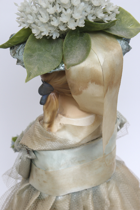 Vintage Doll Holding Blue Flower Bouquet