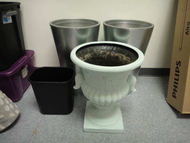 Three Flower Pots and a Trash Can