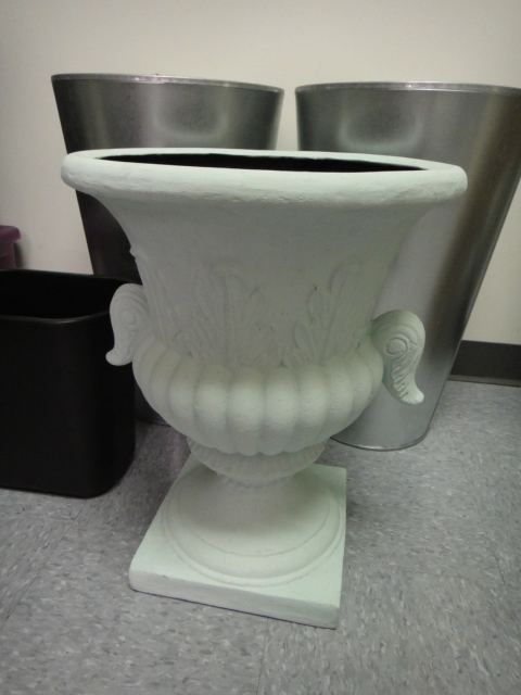 Three Flower Pots and a Trash Can