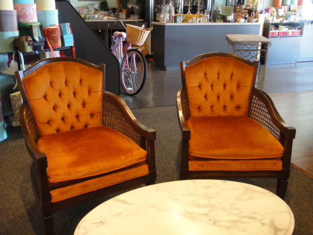 Two Orange Mid Century Arm Chairs