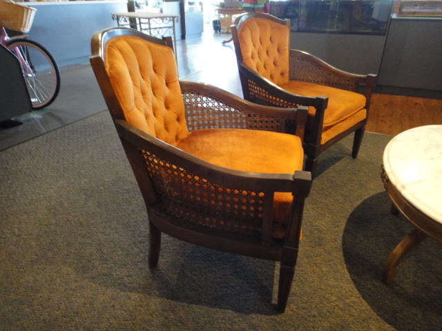 Two Orange Mid Century Arm Chairs