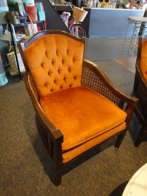 Two Orange Mid Century Arm Chairs