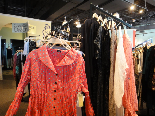 Clothing Rack Filled With New Women's Designer Clothes Size "L"