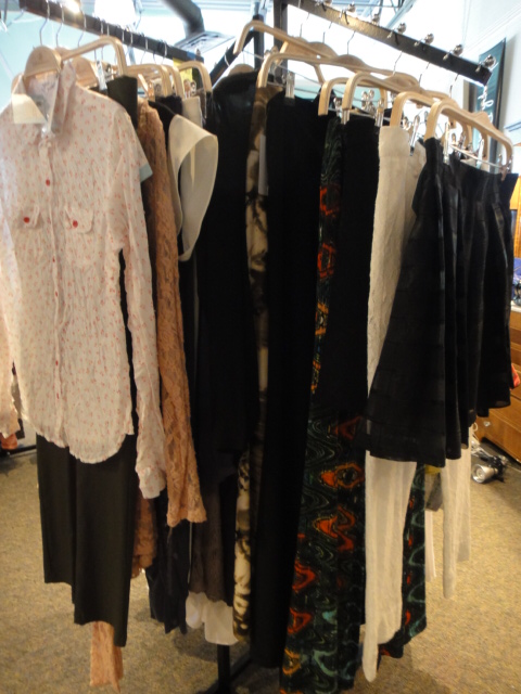 Clothing Rack Filled With New Women's Designer Clothes Size "L"