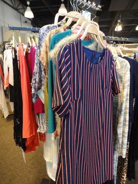 Clothing Rack Filled With New Women's Designer Cloths Size "M"