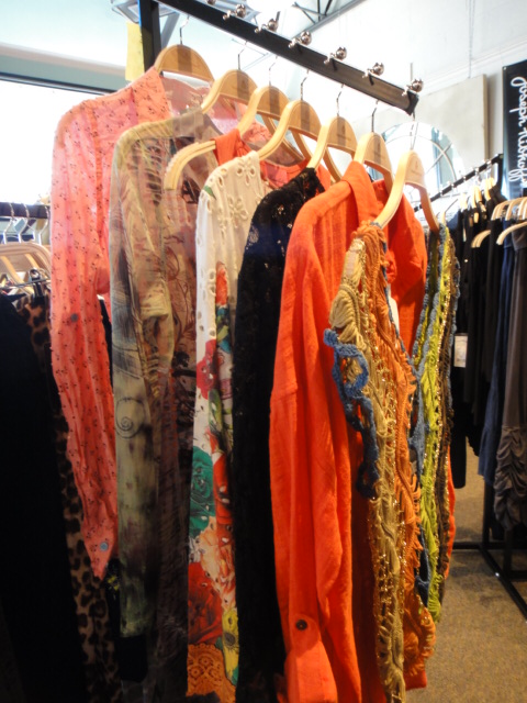 Clothing Rack Filled With New Women's Designer Cloths Size "M"