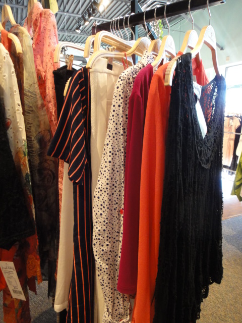 Clothing Rack Filled With New Women's Designer Cloths Size "M"