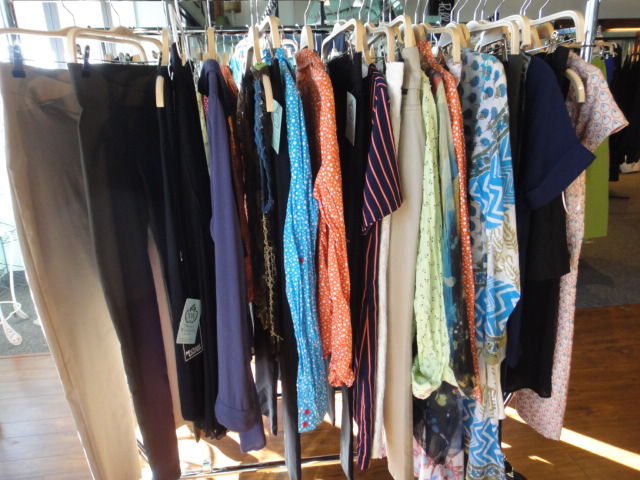 Clothing Rack Filled With New Women's Designer Cloths Size "M"