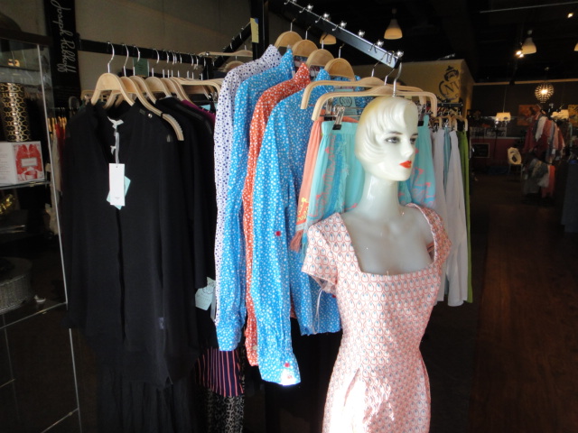 Clothing Rack Filled With New Women's Designer Cloths Size "S"