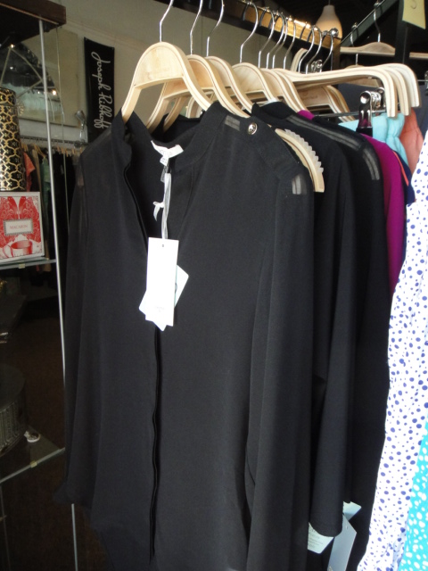 Clothing Rack Filled With New Women's Designer Cloths Size "S"