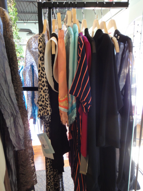 Clothing Rack Filled With New Women's Designer Cloths Size "S"