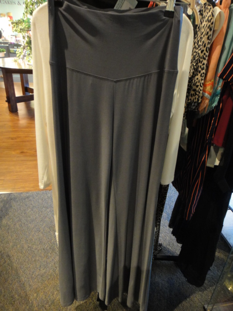 Clothing Rack Filled With New Women's Designer Cloths Size "S"