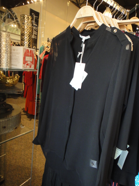 Clothing Rack Filled With New Women's Designer Cloths Size "S"