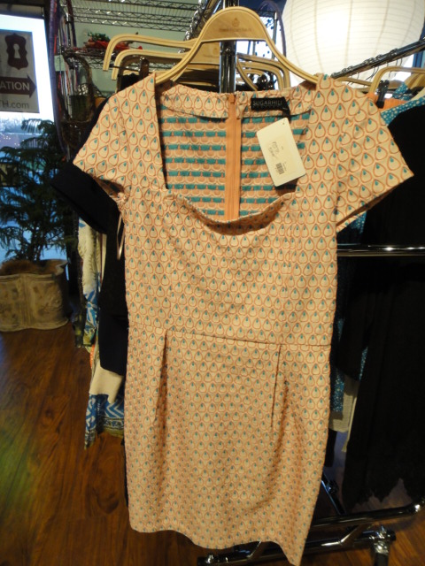 Clothing Rack Filled With New Women's Designer Cloths Size "M"