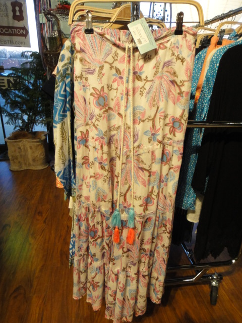 Clothing Rack Filled With New Women's Designer Cloths Size "M"