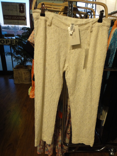 Clothing Rack Filled With New Women's Designer Cloths Size "M"