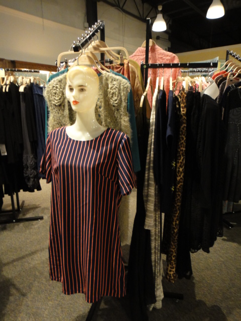 Clothing Rack Filled With New Women's Designer Cloths Size "M"