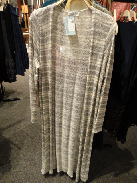 Clothing Rack Filled With New Women's Designer Cloths Size "M"