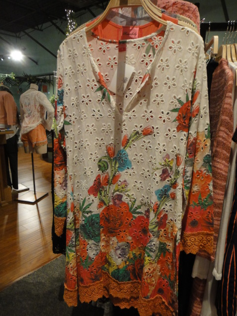 Clothing Rack Filled With New Women's Designer Cloths Size "M"