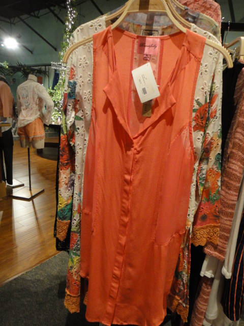 Clothing Rack Filled With New Women's Designer Cloths Size "M"