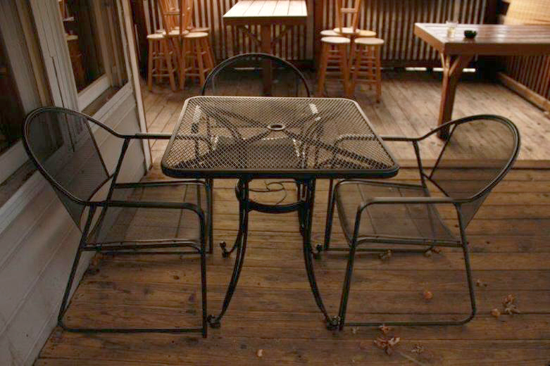 Black Metal Patio Table with Three Chairs