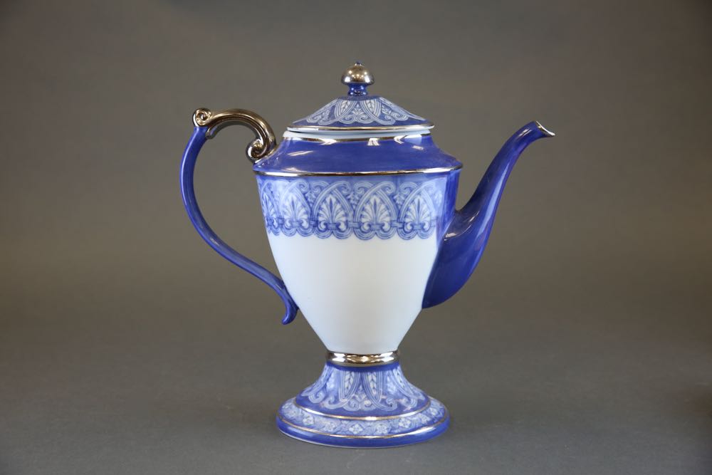 Blue and White Coffee Pot, Serving Dish, and Decorative Plates