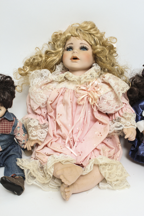 Porcelain Dolls with Curly Hair and Jean Vests