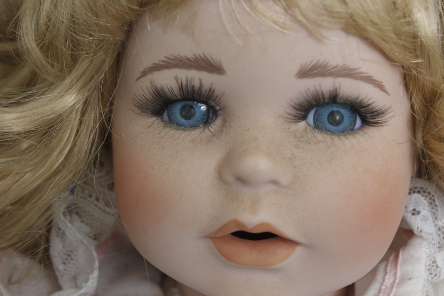 Porcelain Dolls with Curly Hair and Jean Vests