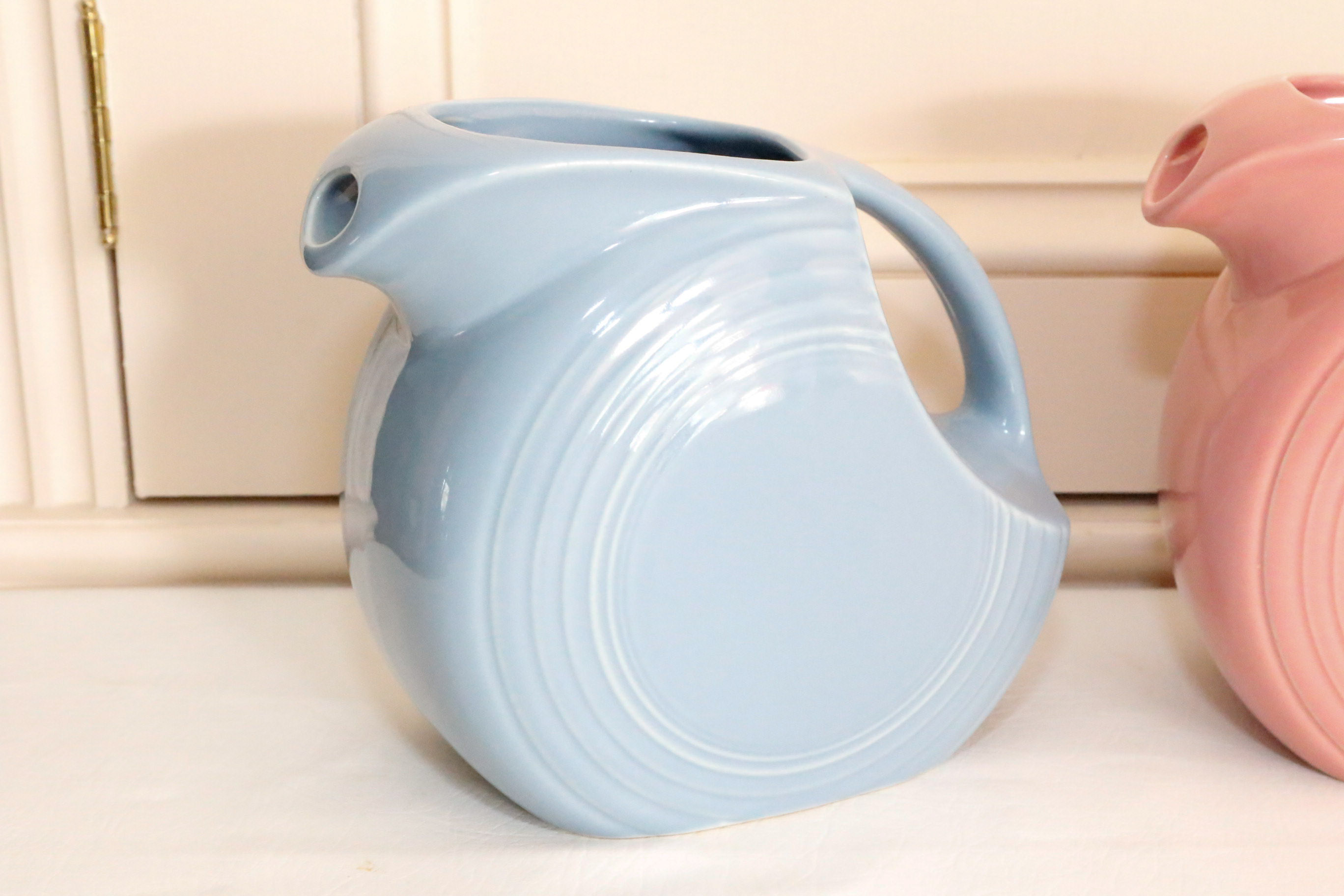 Four Vintage Fiestaware Disc Pitchers in Assorted Colors