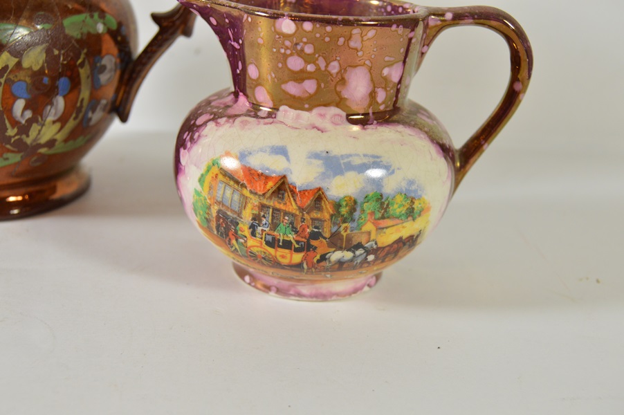 Two Copper Luster Pitchers