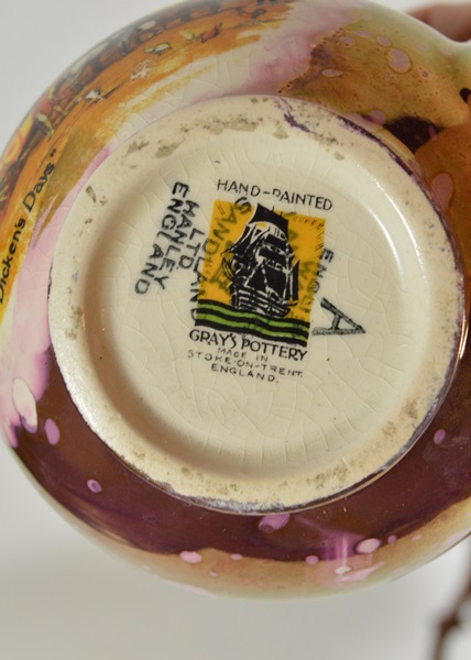 Two Copper Luster Pitchers