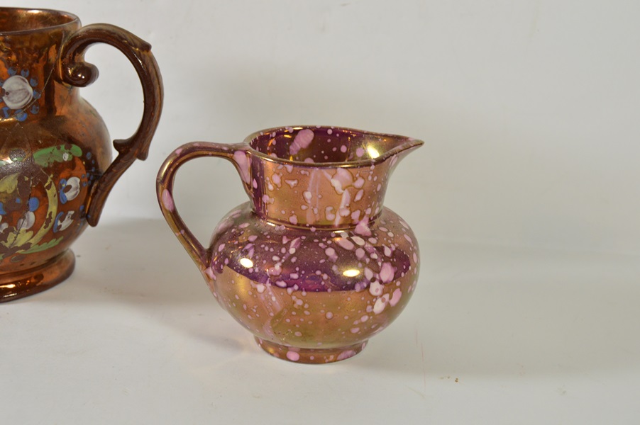 Two Copper Luster Pitchers