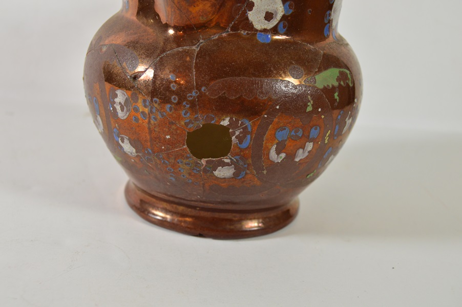 Two Copper Luster Pitchers