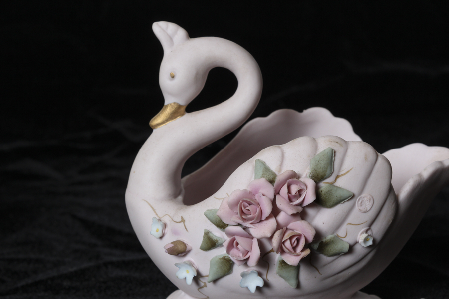 Grouping of Bisque and Porcelain Swans