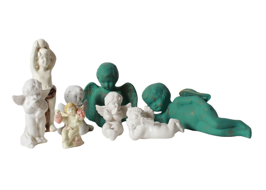 Green and White Angel Figurines