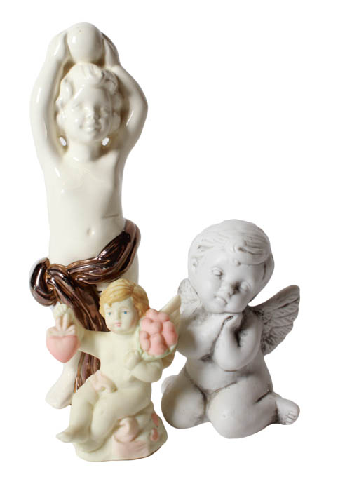 Green and White Angel Figurines