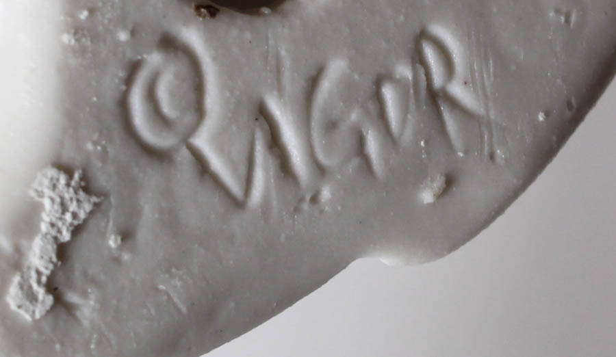 Green and White Angel Figurines