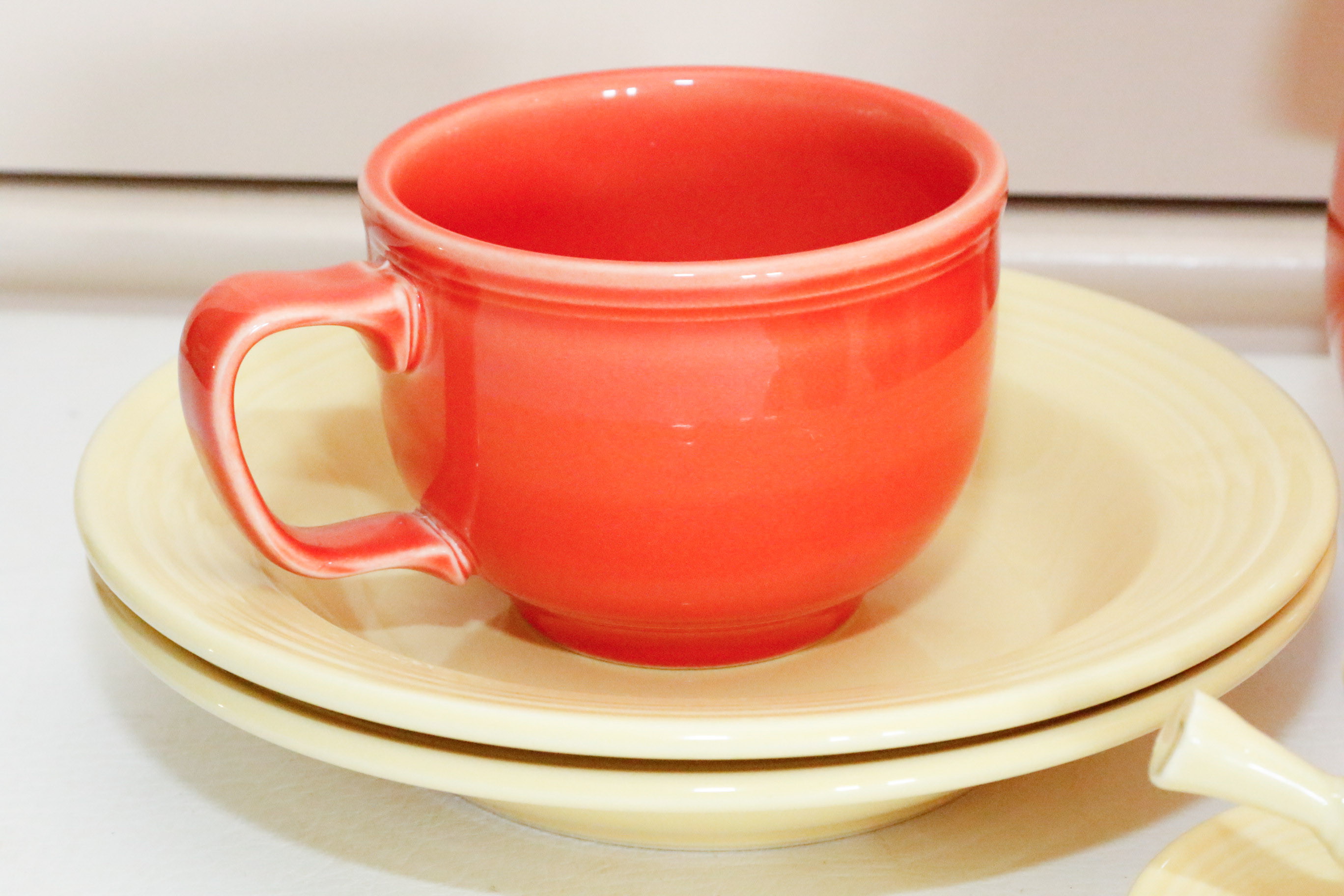 Fiestaware Collection in Persimmon and Post 86' Yellow
