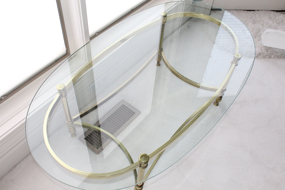 Oval Brass Bottom Glass Topped Coffee Table
