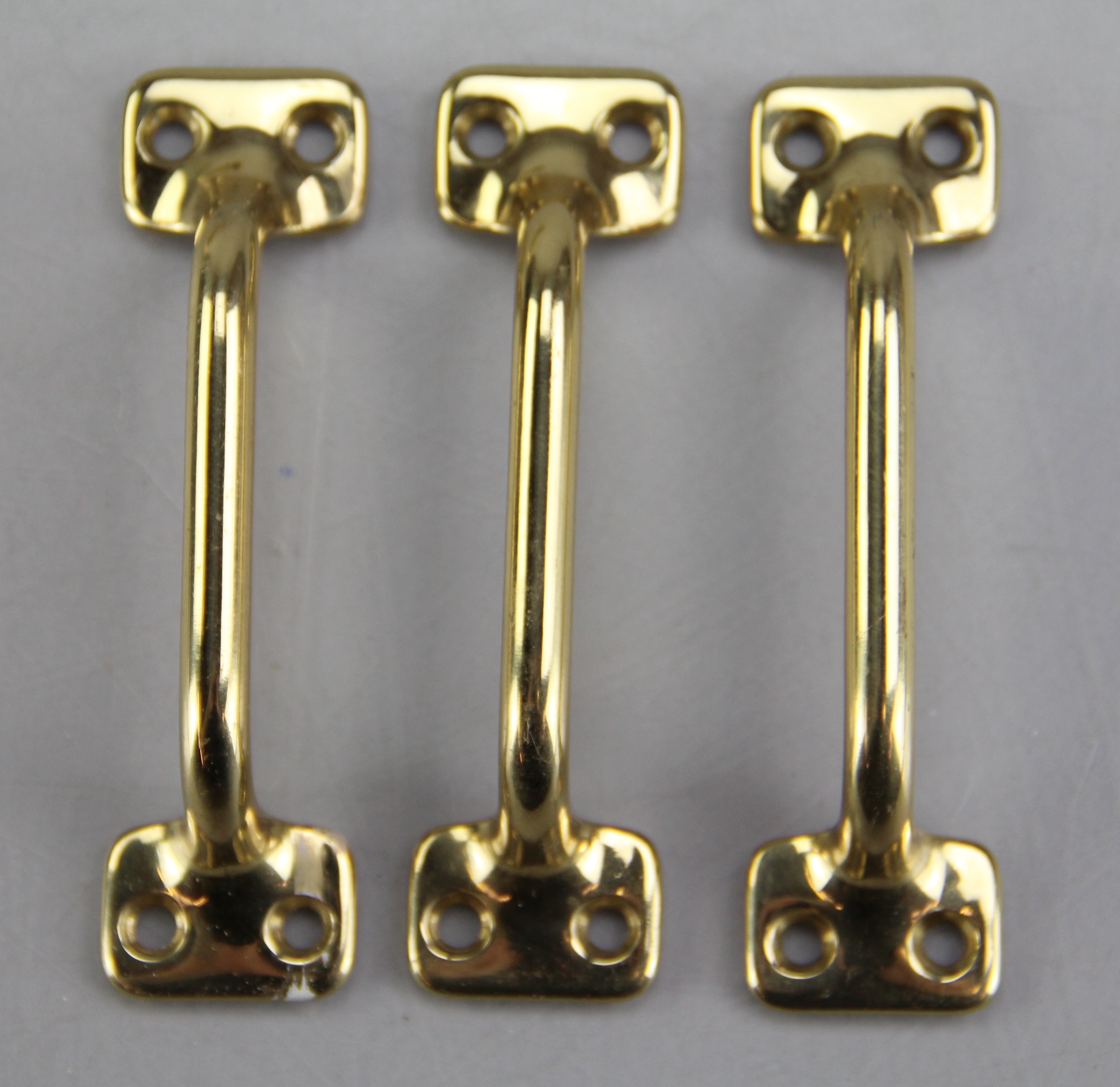 Trio of Polished Brass Lock and Handle Sets