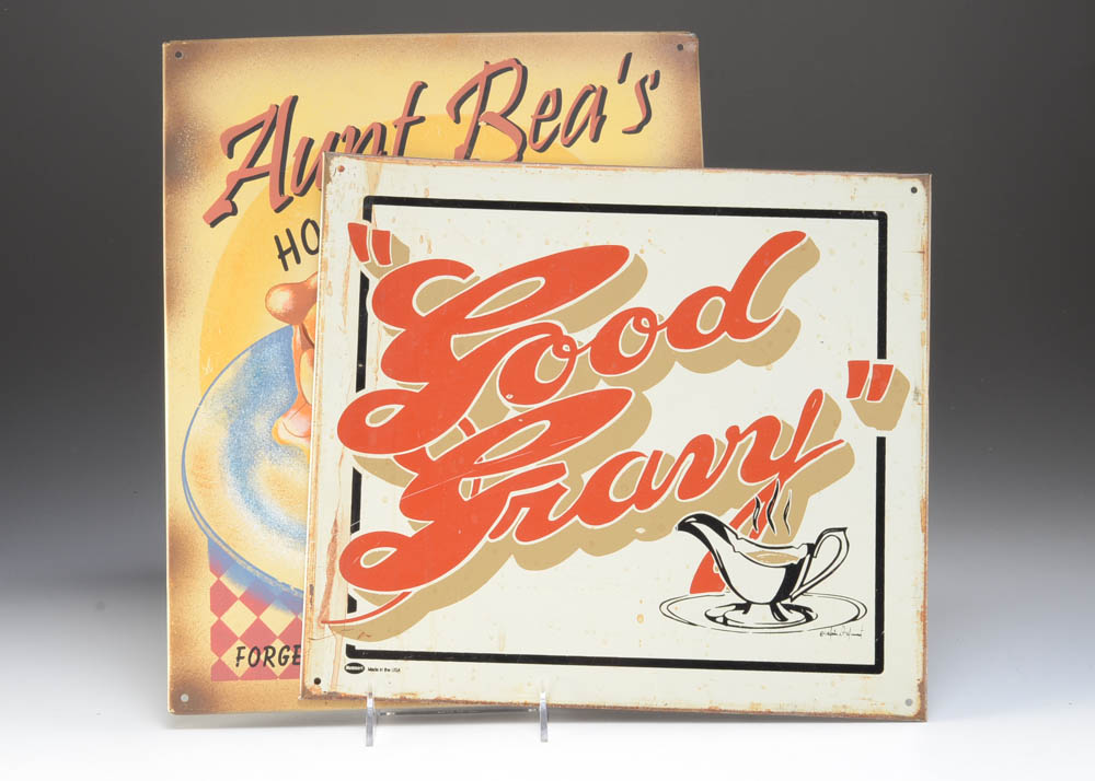 Pair of Feast-Themed Tin Signs