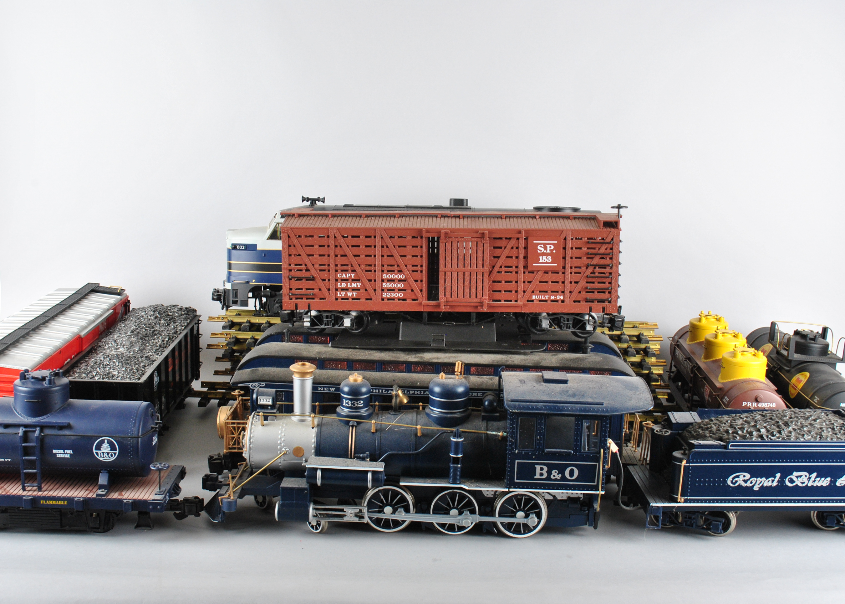 Assortment Of G-Scale Freight Cars, Tracks, And Accessories