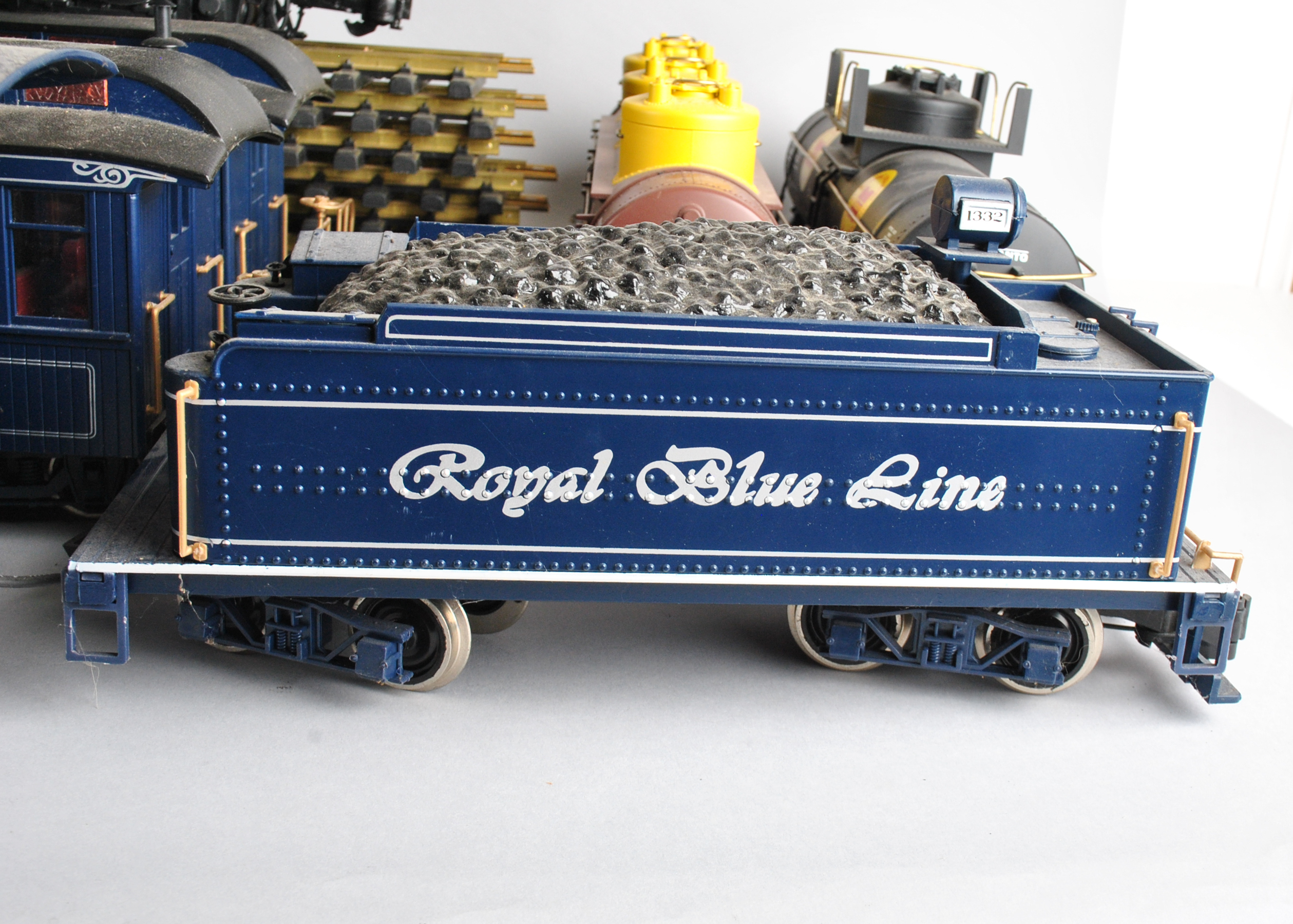 Assortment Of G-Scale Freight Cars, Tracks, And Accessories