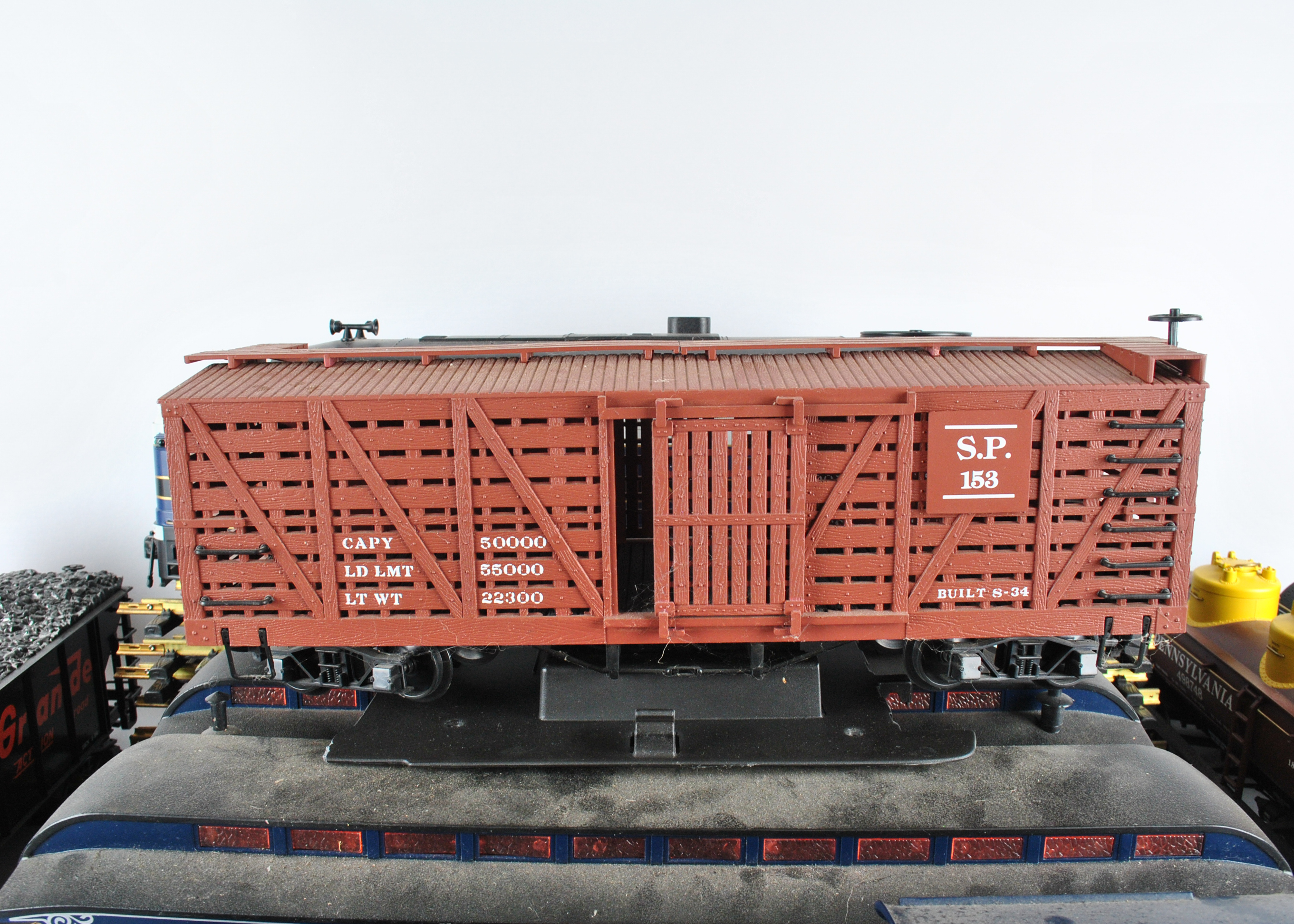 Assortment Of G-Scale Freight Cars, Tracks, And Accessories