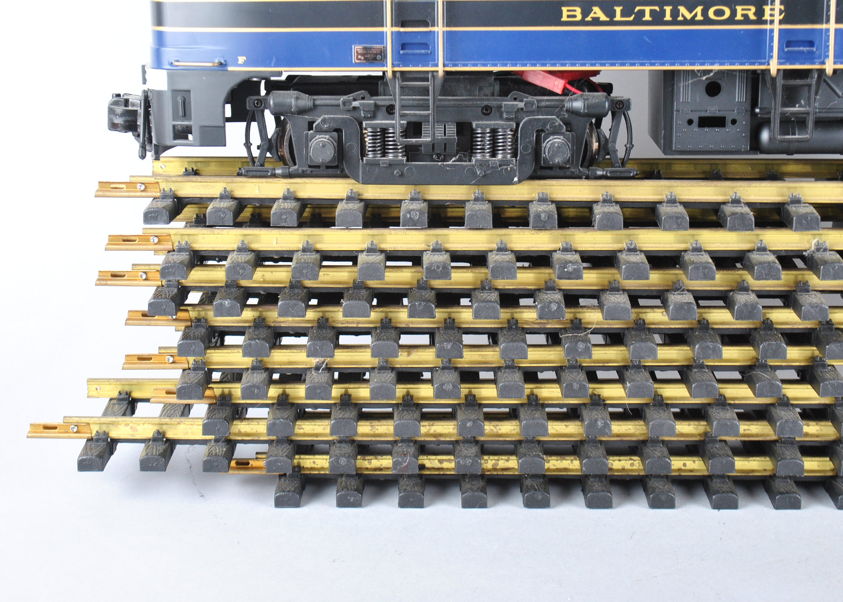 Assortment Of G-Scale Freight Cars, Tracks, And Accessories