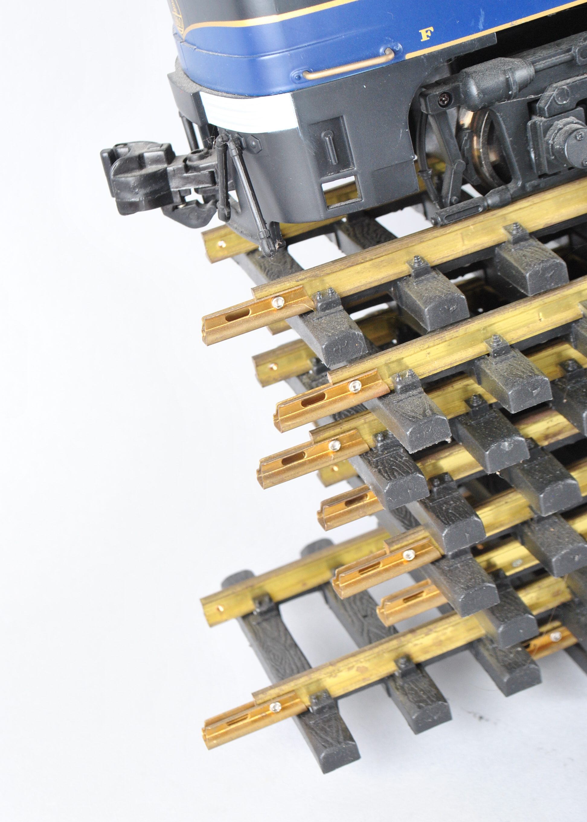 Assortment Of G-Scale Freight Cars, Tracks, And Accessories