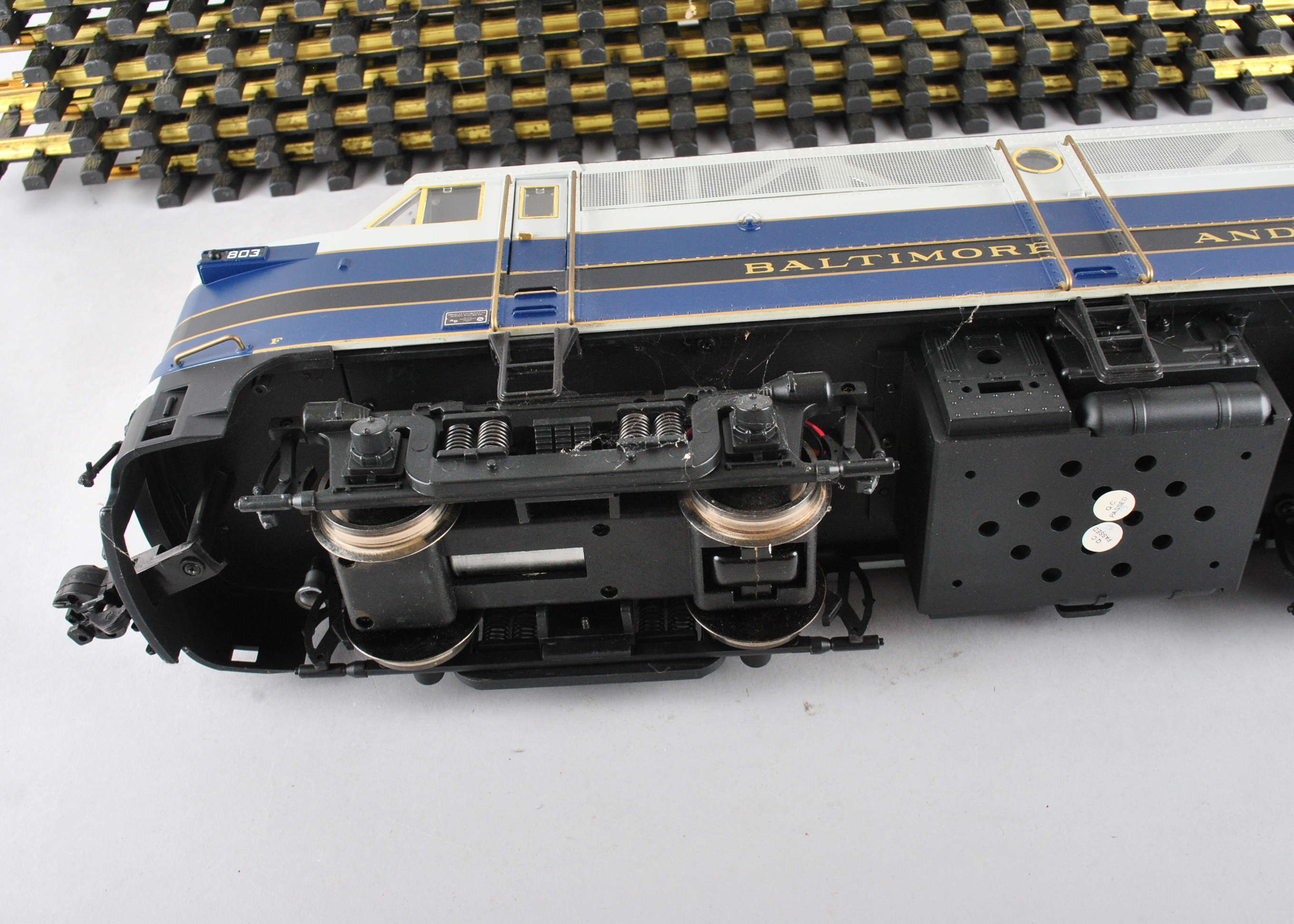 Assortment Of G-Scale Freight Cars, Tracks, And Accessories