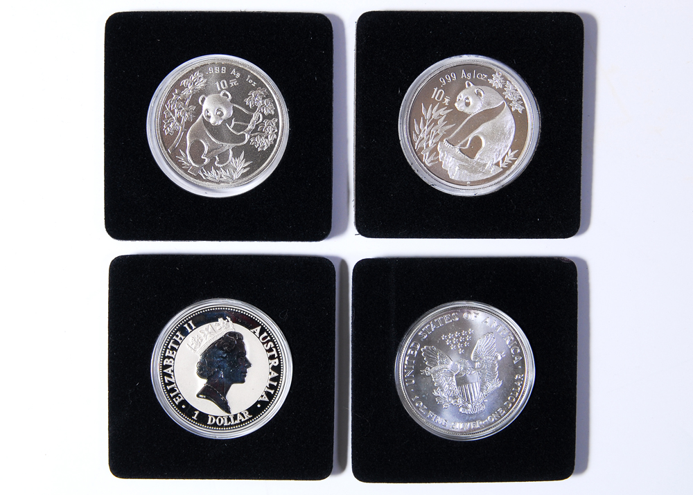 Collection of Four International Silver Coins
