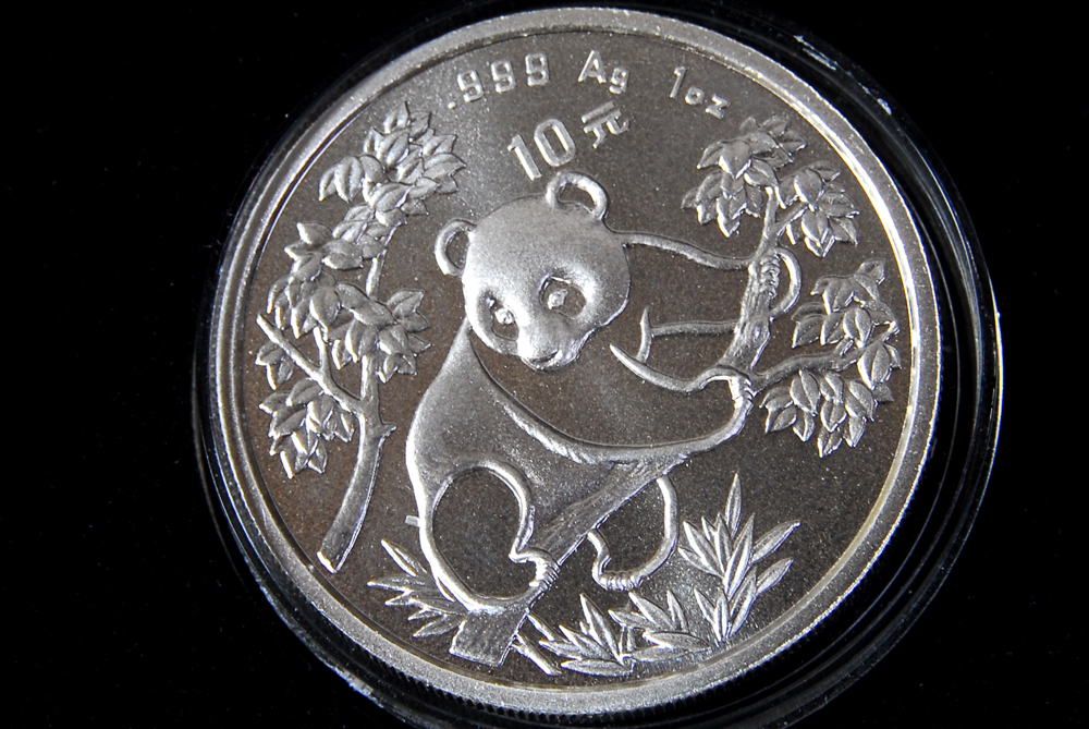 Collection of Four International Silver Coins