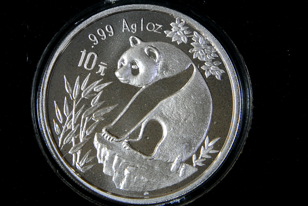 Collection of Four International Silver Coins